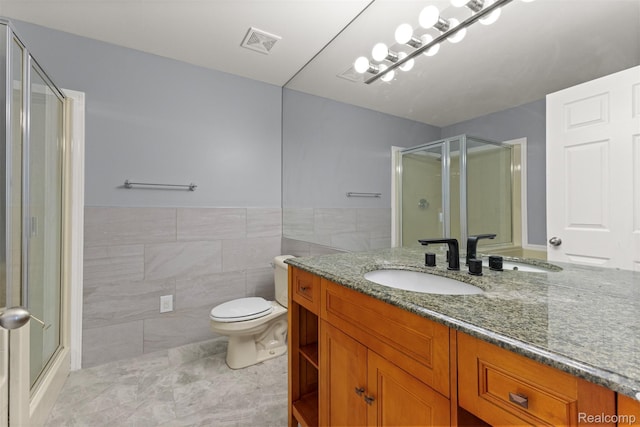 10913 Edlie Cir, Dearborn Heights, MI 48214 - full bath with a shower with door, vanity, tile walls, wainscoting, and tile patterned floors