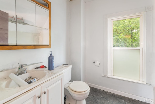 735 W Stewart St, Owosso, MI 48867 - bathroom featuring vanity and toilet