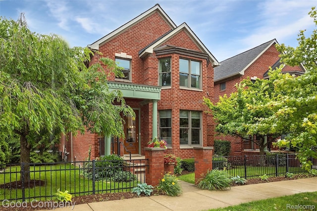 605 S Troy St, Royal Oak, MI 48067 - view of front of house featuring brick siding and a fenced front yard