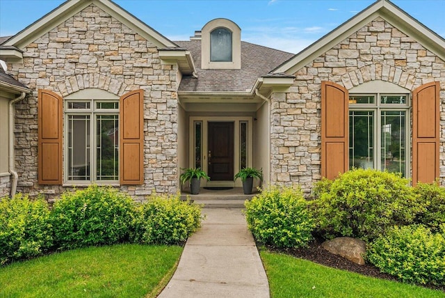 7870 Mooring Ct, Hudsonville, MI 49426 - doorway to property with stone siding and a shingled roof