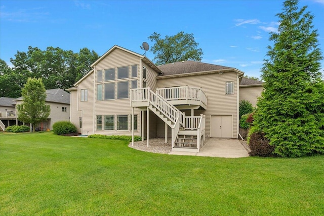7870 Mooring Ct, Hudsonville, MI 49426 - back of house with stairway, a wooden deck, a lawn, and roof with shingles