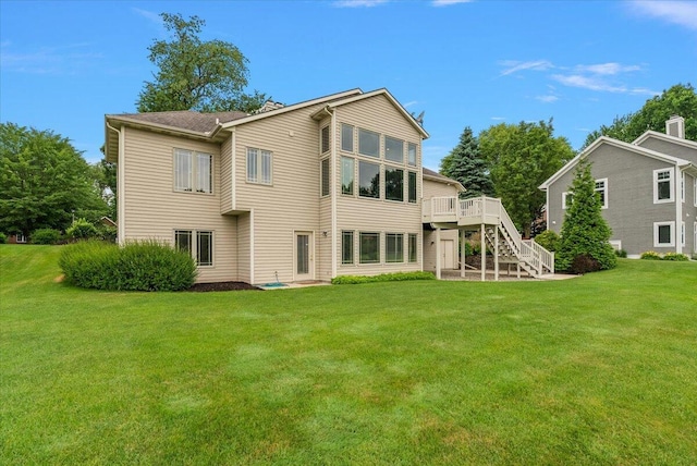 7870 Mooring Ct, Hudsonville, MI 49426 - back of house featuring stairs, a lawn, and a deck