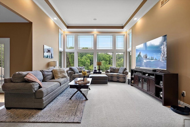 7870 Mooring Ct, Hudsonville, MI 49426 - living room featuring crown molding, plenty of natural light, carpet flooring, a towering ceiling, and a raised ceiling