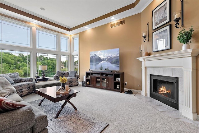 7870 Mooring Ct, Hudsonville, MI 49426 - living area with crown molding, a high ceiling, a fireplace, light colored carpet, and light tile patterned floors