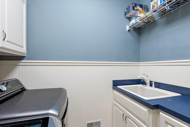 7870 Mooring Ct, Hudsonville, MI 49426 - washroom with a wainscoted wall and cabinet space