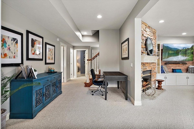 7870 Mooring Ct, Hudsonville, MI 49426 - carpeted home office with a fireplace and recessed lighting