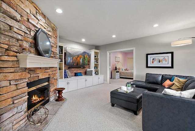 7870 Mooring Ct, Hudsonville, MI 49426 - living area featuring carpet flooring, a stone fireplace, and recessed lighting