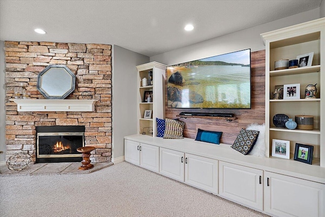7870 Mooring Ct, Hudsonville, MI 49426 - living room featuring light carpet, a stone fireplace, and recessed lighting