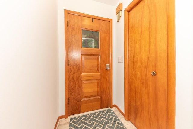 1169 Wilbur, Pinckney, MI 48169 - doorway to outside featuring baseboards