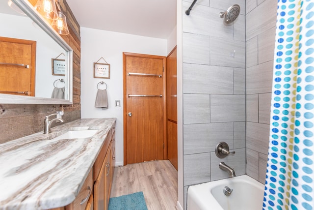 1169 Wilbur, Pinckney, MI 48169 - full bathroom featuring vanity, shower / tub combo with curtain, wood finished floors, and tasteful backsplash