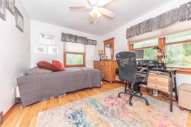 1169 Wilbur, Pinckney, MI 48169 - bedroom with wood finished floors, an office area, and a ceiling fan