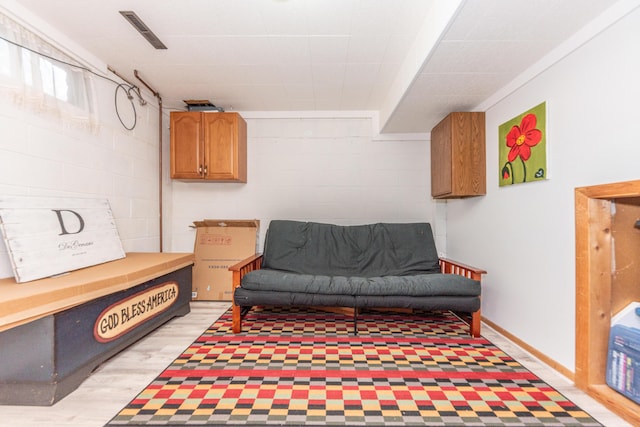 1169 Wilbur, Pinckney, MI 48169 - sitting room with concrete block wall and light wood-type flooring