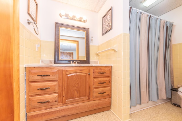 1169 Wilbur, Pinckney, MI 48169 - full bathroom featuring tile walls, vanity, a shower with curtain, and a wainscoted wall
