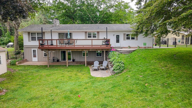 1169 Wilbur, Pinckney, MI 48169 - back of house with a wooden deck, a patio, and a chimney