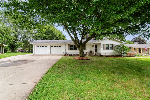 1169 Wilbur, Pinckney, MI 48169 - ranch-style house with an attached garage, driveway, and a front lawn