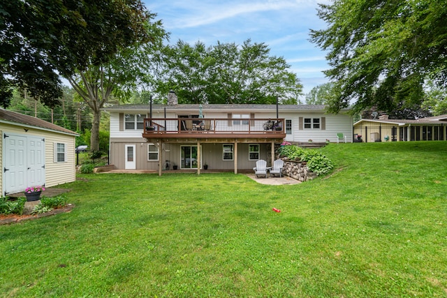 1169 Wilbur, Pinckney, MI 48169 - back of house featuring a wooden deck, a chimney, a patio, and a lawn