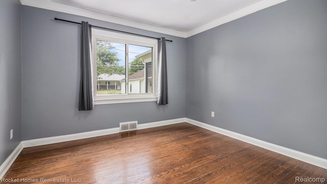 22011 Englehardt St, Saint Clair Shores, MI 48080 - empty room featuring dark wood finished floors and ornamental molding
