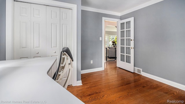 22011 Englehardt St, Saint Clair Shores, MI 48080 - unfurnished office featuring french doors, wood finished floors, and ornamental molding
