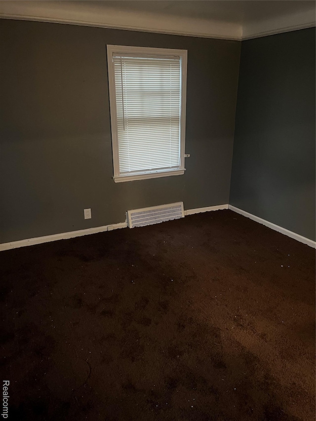 19500 Rutherford St, Detroit, MI 48235 - carpeted empty room with baseboards and crown molding