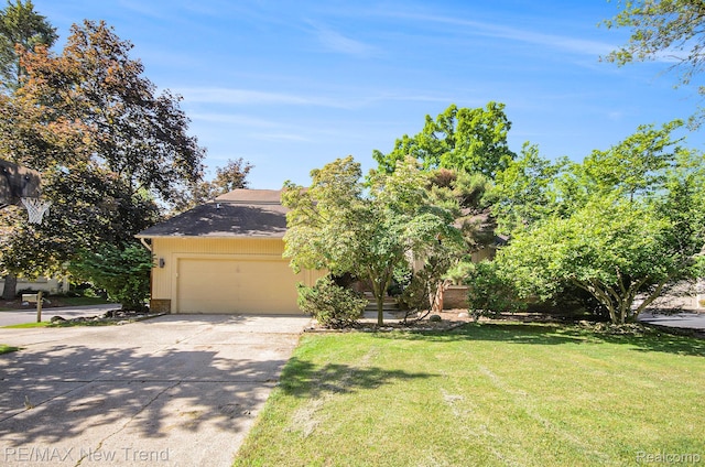 3234 Pine Lake Rd, West Bloomfield, MI 48324 - view of property hidden behind natural elements with driveway, a garage, and a front yard