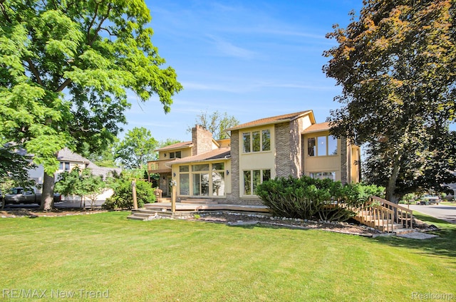 3234 Pine Lake Rd, West Bloomfield, MI 48324 - back of property featuring a lawn