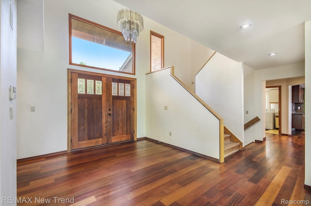 3234 Pine Lake Rd, West Bloomfield, MI 48324 - foyer with wood finished floors, a chandelier, stairs, recessed lighting, and washer / clothes dryer