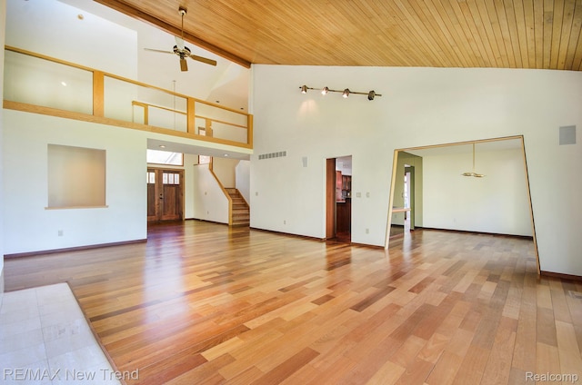 3234 Pine Lake Rd, West Bloomfield, MI 48324 - unfurnished living room with a towering ceiling, wood ceiling, light wood-type flooring, ceiling fan, and stairway