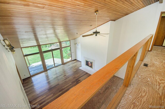 3234 Pine Lake Rd, West Bloomfield, MI 48324 - unfurnished living room with vaulted ceiling, wooden ceiling, a fireplace with flush hearth, a ceiling fan, and wood finished floors