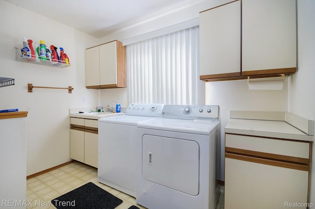3234 Pine Lake Rd, West Bloomfield, MI 48324 - washroom with washer and dryer, cabinet space, and light flooring
