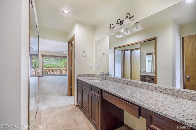 3234 Pine Lake Rd, West Bloomfield, MI 48324 - bathroom featuring vanity, recessed lighting, and a chandelier