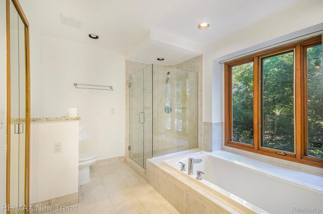 3234 Pine Lake Rd, West Bloomfield, MI 48324 - full bathroom featuring a stall shower, a bath, and recessed lighting