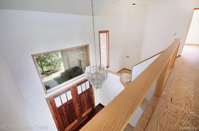 3234 Pine Lake Rd, West Bloomfield, MI 48324 - foyer entrance with a towering ceiling, plenty of natural light, and a chandelier