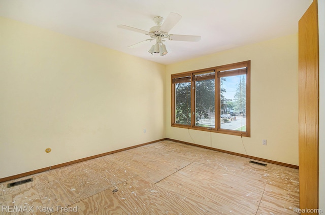 3234 Pine Lake Rd, West Bloomfield, MI 48324 - spare room with baseboards and a ceiling fan