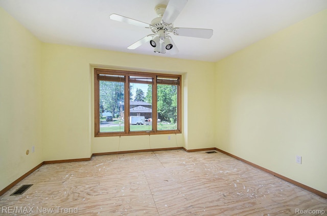 3234 Pine Lake Rd, West Bloomfield, MI 48324 - spare room with baseboards and ceiling fan