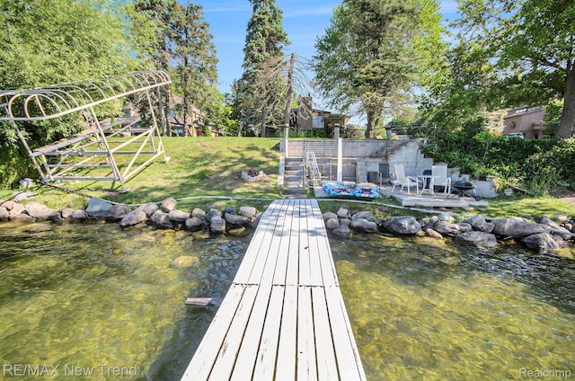 3234 Pine Lake Rd, West Bloomfield, MI 48324 - dock area with a yard