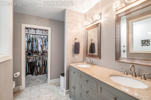 5408 N Seymour Rd, Flushing, MI 48433 - full bathroom with double vanity and a walk in closet