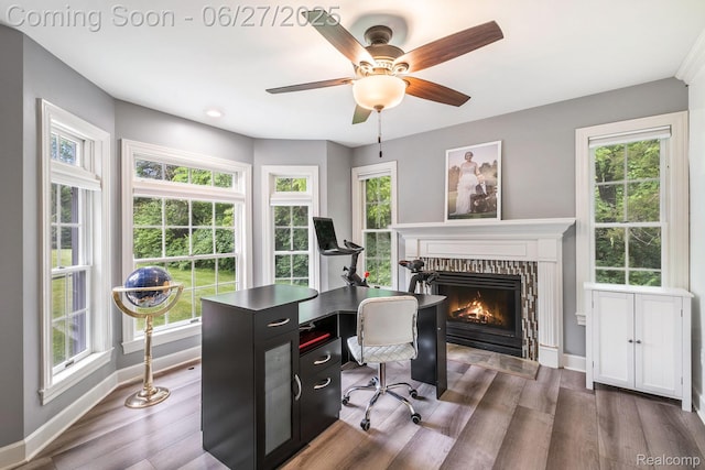 5408 N Seymour Rd, Flushing, MI 48433 - home office featuring a lit fireplace, wood finished floors, and ceiling fan
