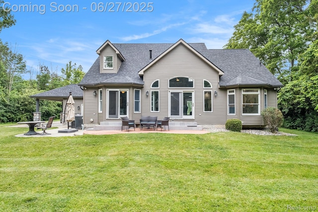 5408 N Seymour Rd, Flushing, MI 48433 - rear view of property featuring entry steps, a shingled roof, a patio, and a lawn