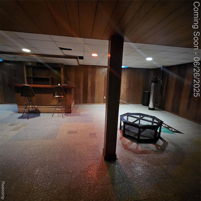 30146 Boewe Dr, Warren, MI 48092 - finished basement with bar area, wooden walls, and a paneled ceiling