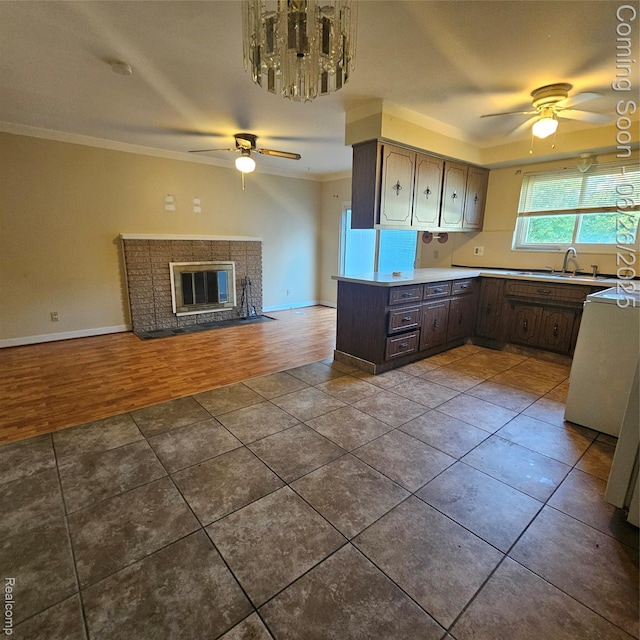 30146 Boewe Dr, Warren, MI 48092 - kitchen with a ceiling fan, open floor plan, ornamental molding, tile patterned flooring, and light countertops
