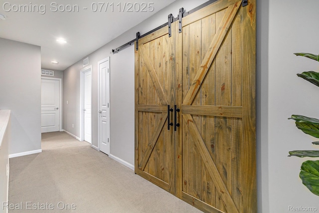 59141 Peters Barn Dr, South Lyon, MI 48178 - corridor featuring a barn door, carpet flooring, and recessed lighting