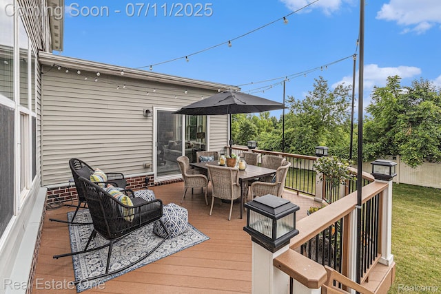 59141 Peters Barn Dr, South Lyon, MI 48178 - deck with outdoor dining area and a lawn