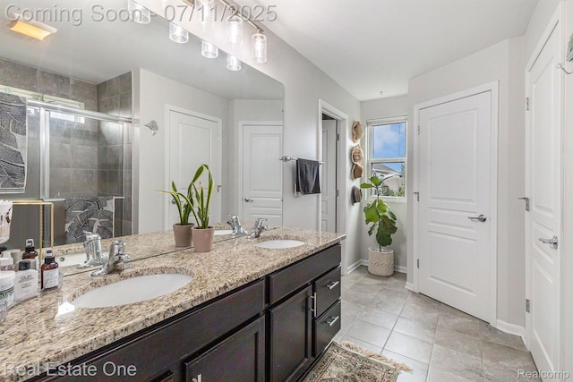 59141 Peters Barn Dr, South Lyon, MI 48178 - bathroom featuring double vanity, a shower stall, and tile patterned floors