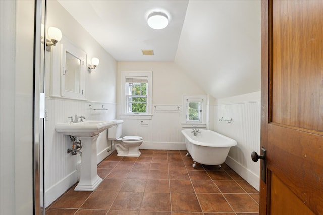450 S 1st St, Ann Arbor, MI 48103 - full bath with a soaking tub, tile patterned floors, vaulted ceiling, and wainscoting