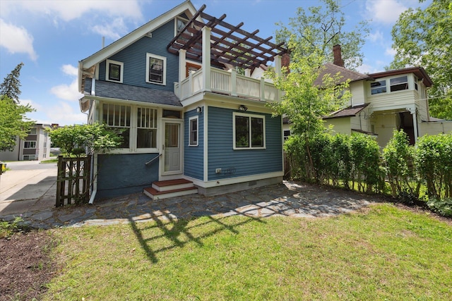 450 S 1st St, Ann Arbor, MI 48103 - back of house with a balcony, entry steps, and a lawn