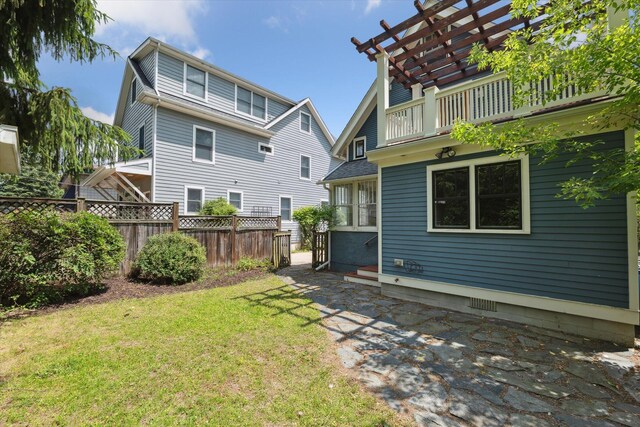 450 S 1st St, Ann Arbor, MI 48103 - back of house featuring a balcony and a patio