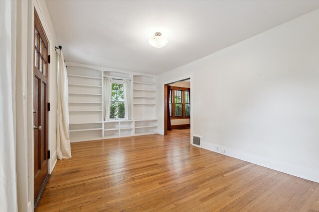 450 S 1st St, Ann Arbor, MI 48103 - unfurnished room with built in shelves and light wood finished floors