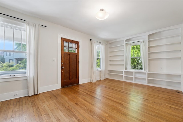 450 S 1st St, Ann Arbor, MI 48103 - foyer entrance featuring light wood-type flooring and baseboards