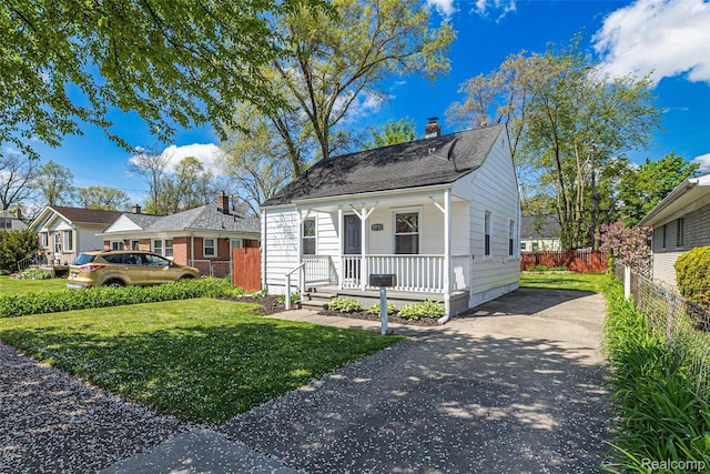 23723 Vassar Ave, Hazel Park, MI 48030 - bungalow featuring covered porch, driveway, a chimney, and a shingled roof