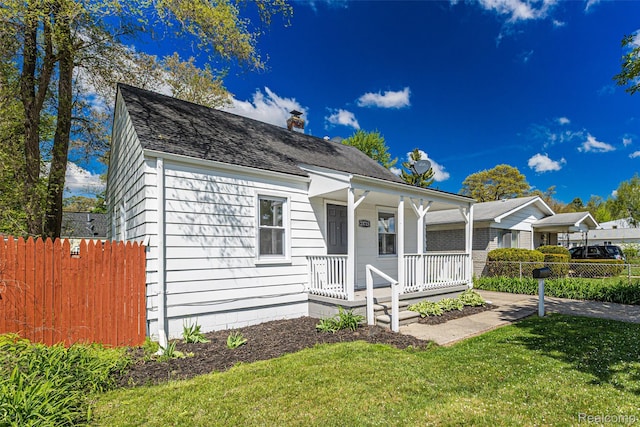 23723 Vassar Ave, Hazel Park, MI 48030 - view of front of property with covered porch, a chimney, and a shingled roof
